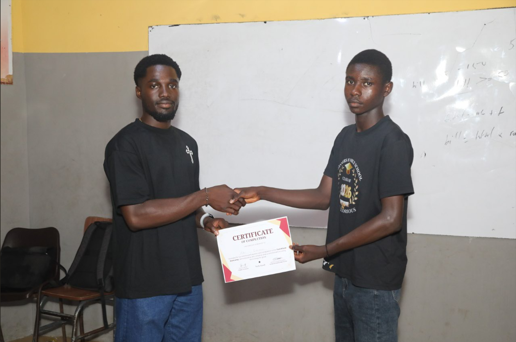 Student receiving certificate